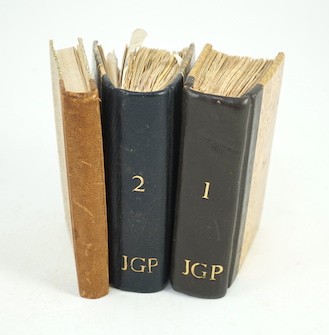(Pearson, John - Ms. Notebooks) 2 small octavo notebooks of 120 and 100pp. (approx.) filled with pasted-in receipts, labels, tickets, adverts., cuttings and the like; together with contact